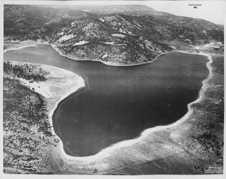 A black and white historical photo of Baldwin Lake filled up with water in Big Bear California.
